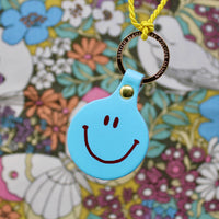 Feeling Lush Smilie Face Key Fob - Coral